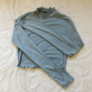 Light blue long sleeve shirt with a ruched hem